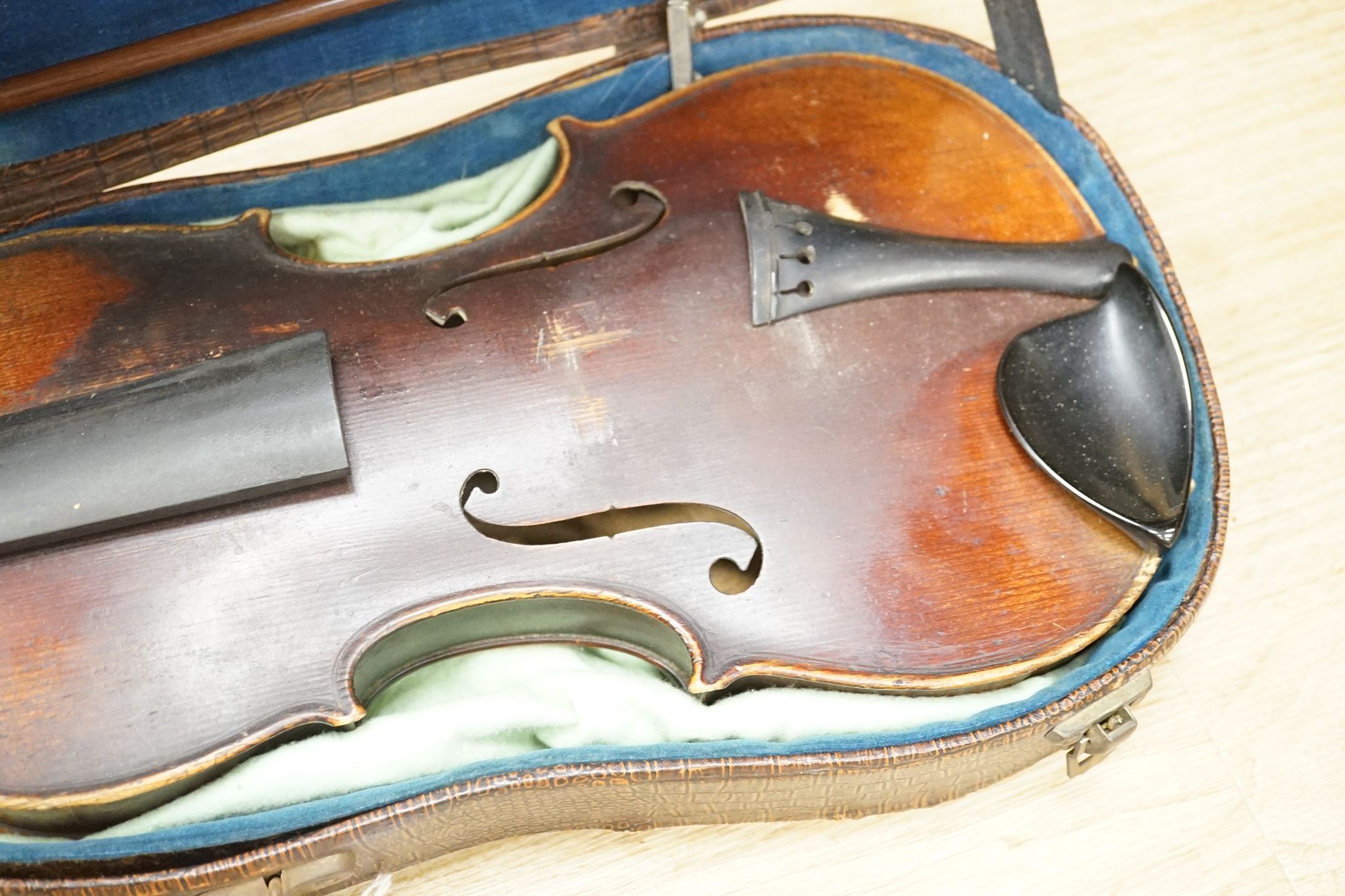 A late 19th century German violin and two bows, cased